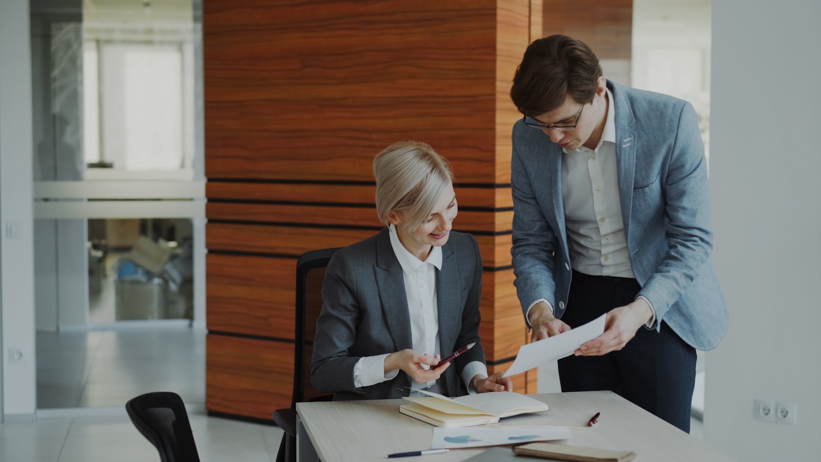 Consultants reviewing work together